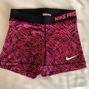Pink and black Nike Pro Small Workout shorts